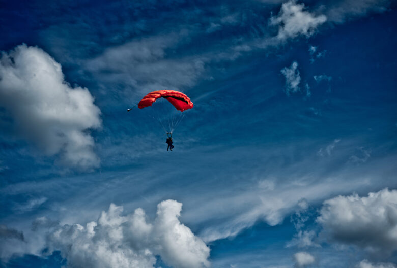 red parachute in sky