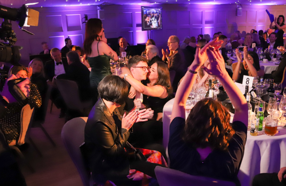 People sat around a table at Fetcher Dog's annual charity ball celebrating the events success