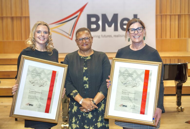 Lou & Karen collecting BMet Fellowship Award