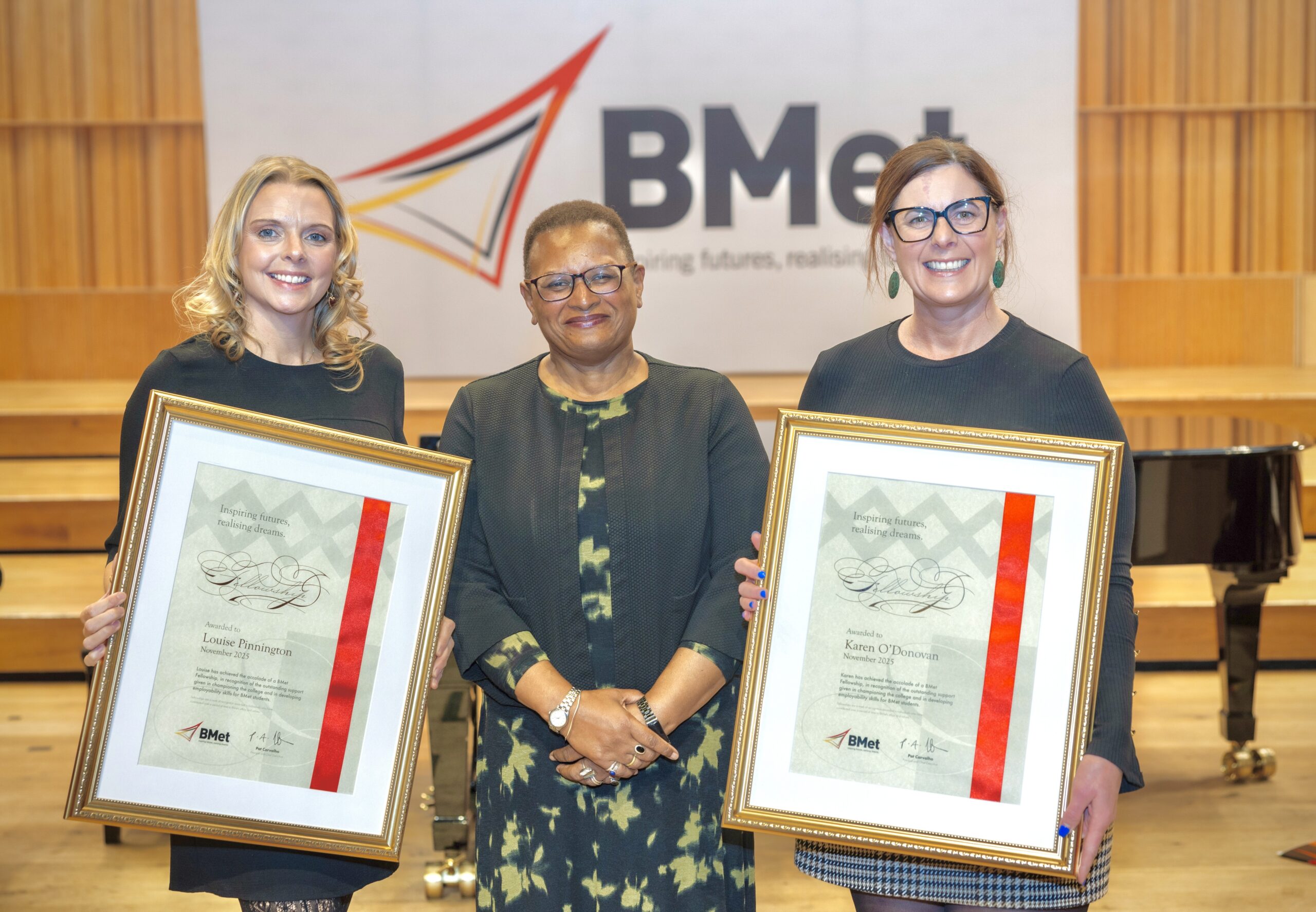 Lou & Karen collecting BMet Fellowship Award